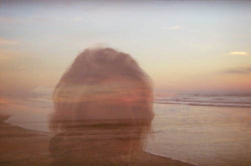 Free A Double Exposure Photo of a Woman and Seashore
 Stock Photo