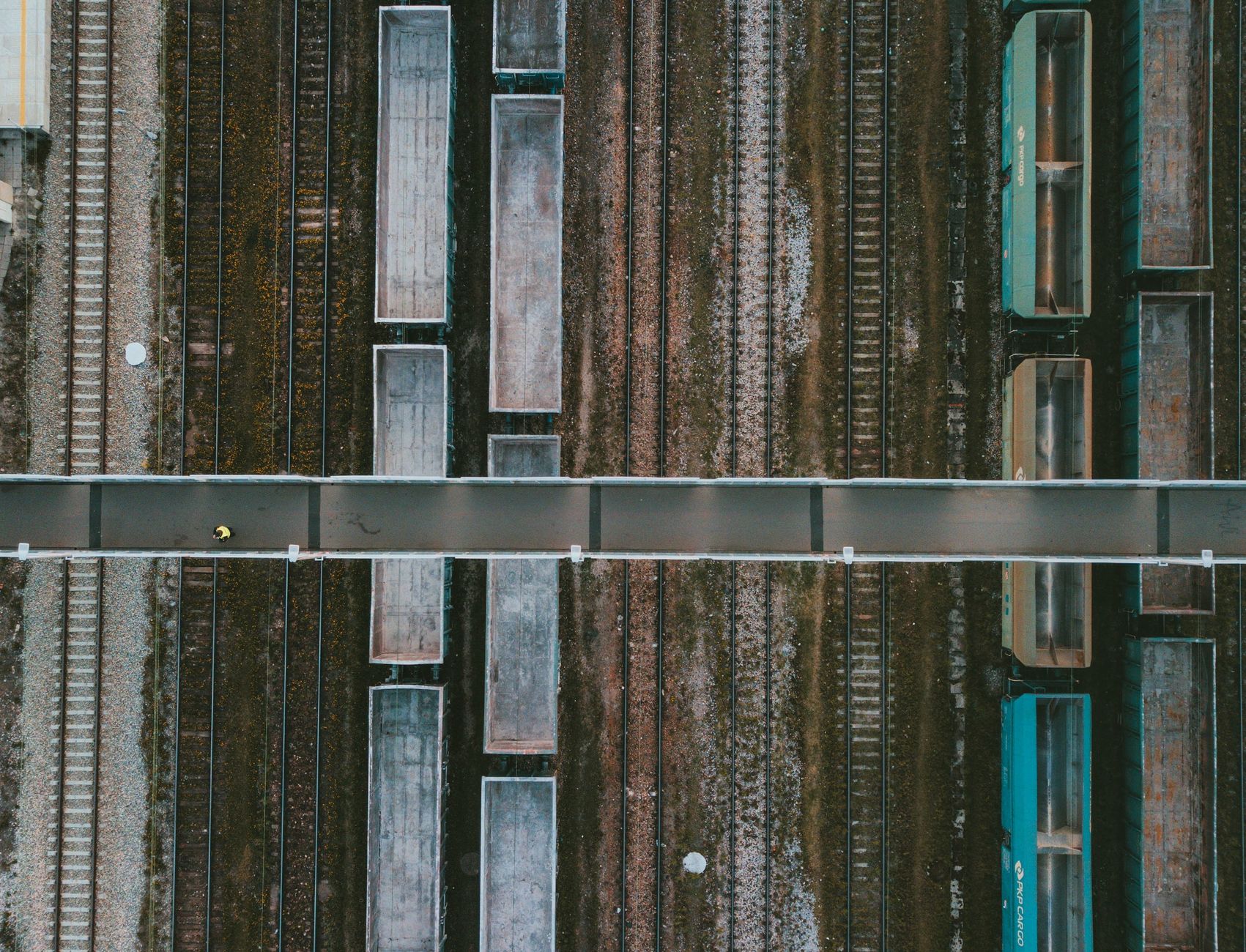 Drone shot of a railway in Poland showcasing cargo trains and tracks from above.
