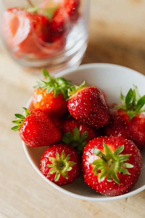 Close-up Shot of Fresh Strawberries in White Ceramic Bowl