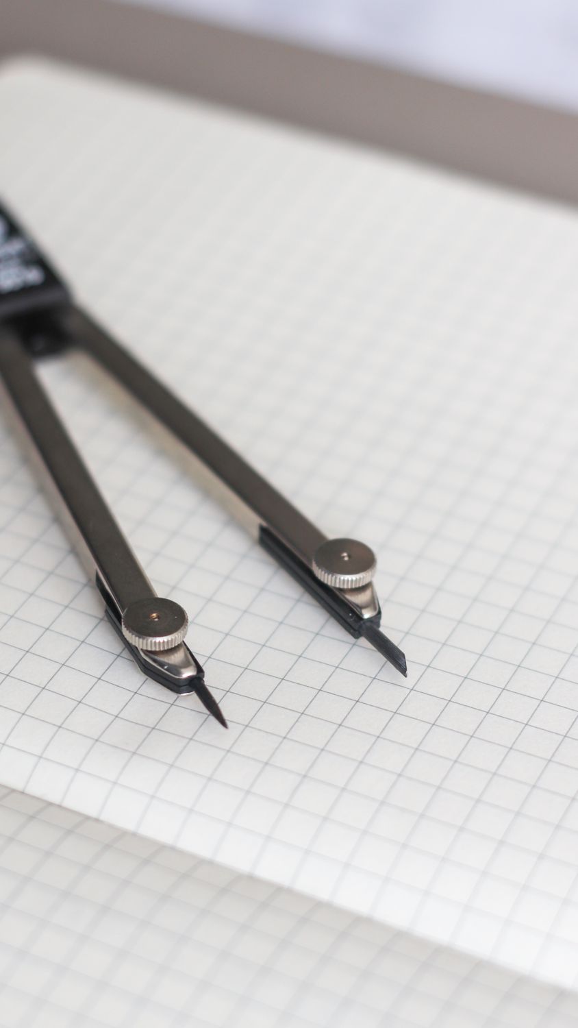 Compass on Graphing Paper · Free Stock Photo