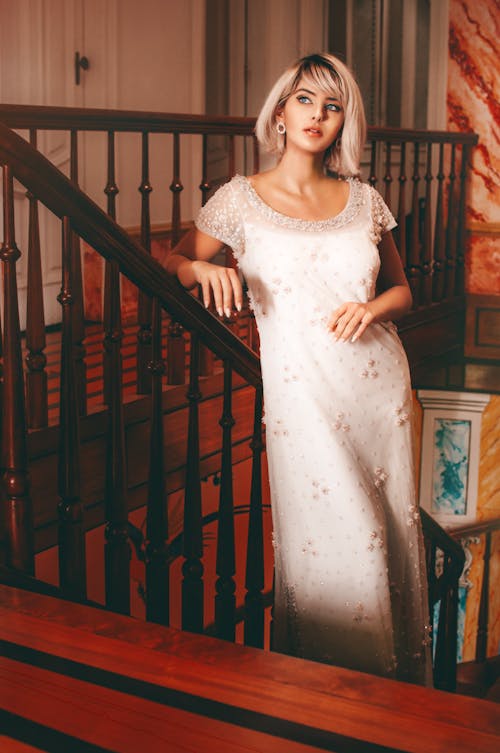 Elegant woman standing near railing