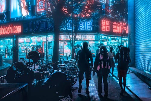 People Walking on the Street During Night Time