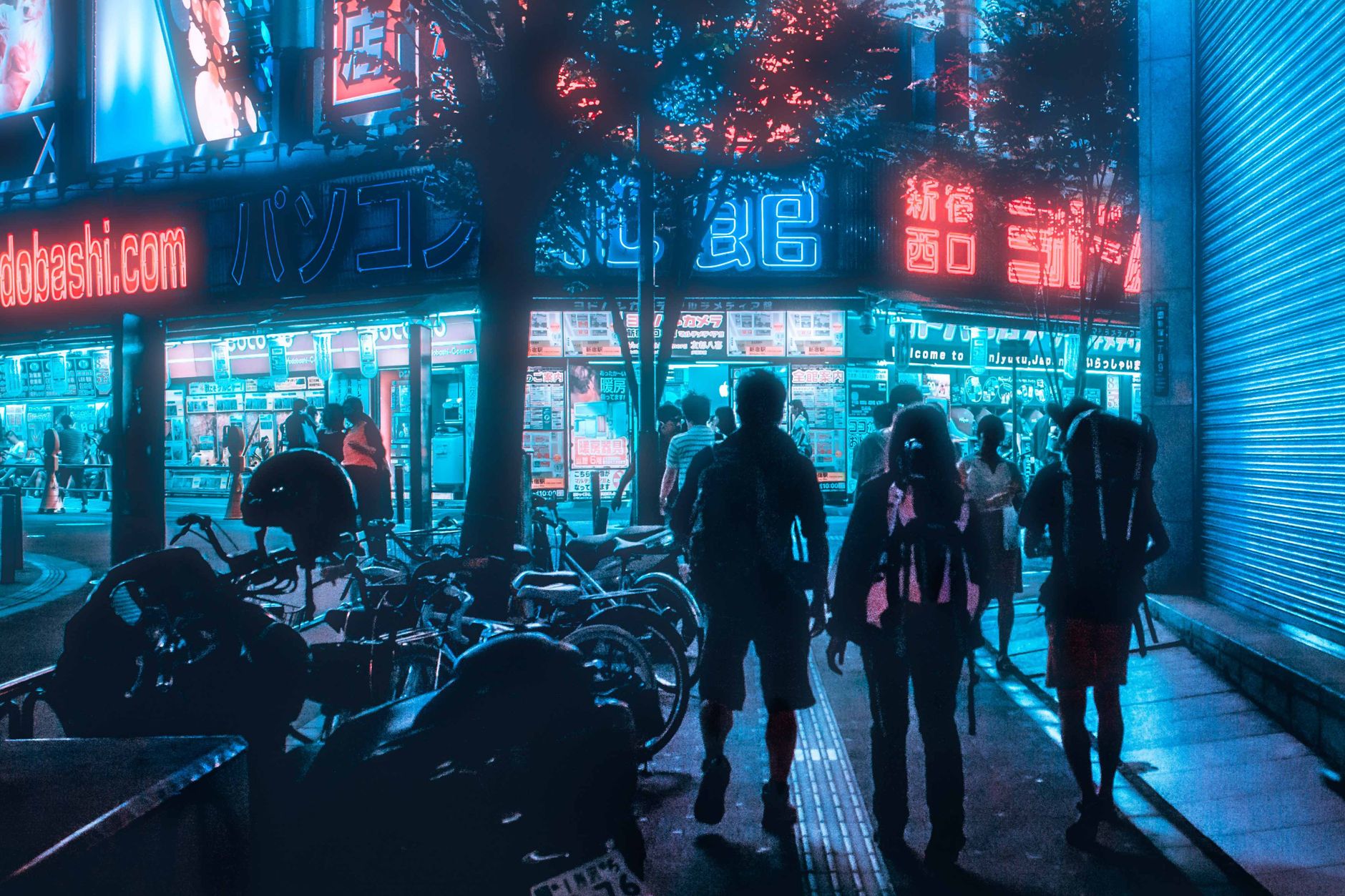 Urban street scene at night with neon lights and people walking.. urban, street, scene