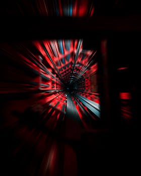 Abstract view of a fast-moving red-lit tunnel in Brussels, Belgium.