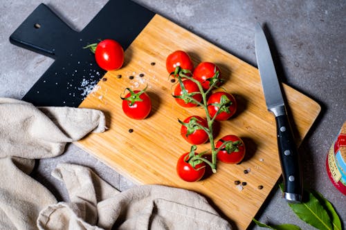 Tomatoes on Wooden Chopping Board