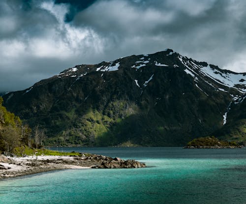 Green and Brown Mountain Under the Cloudy Sky 