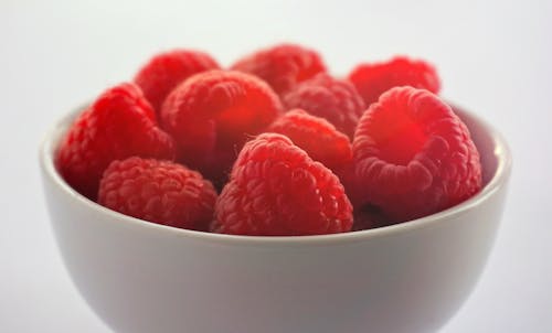 Raspberries on White Ceramic Bowl