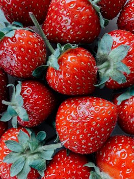High resolution close-up of fresh red strawberries, perfect for food and nutrition themes.