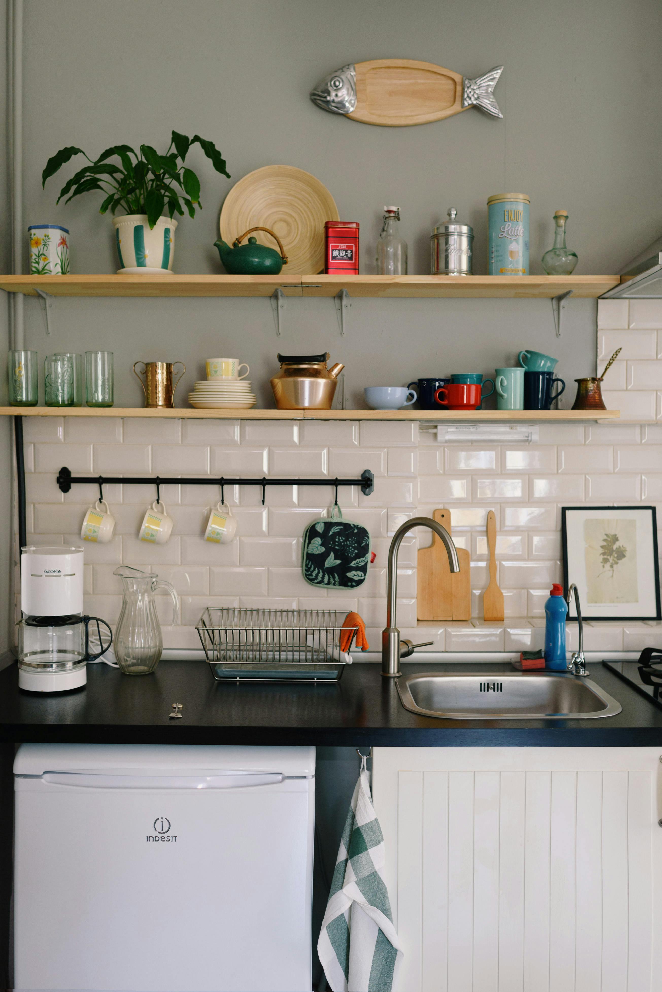 Modern kitchen interior with sink and kitchenware on shelves \u00b7 Free ...