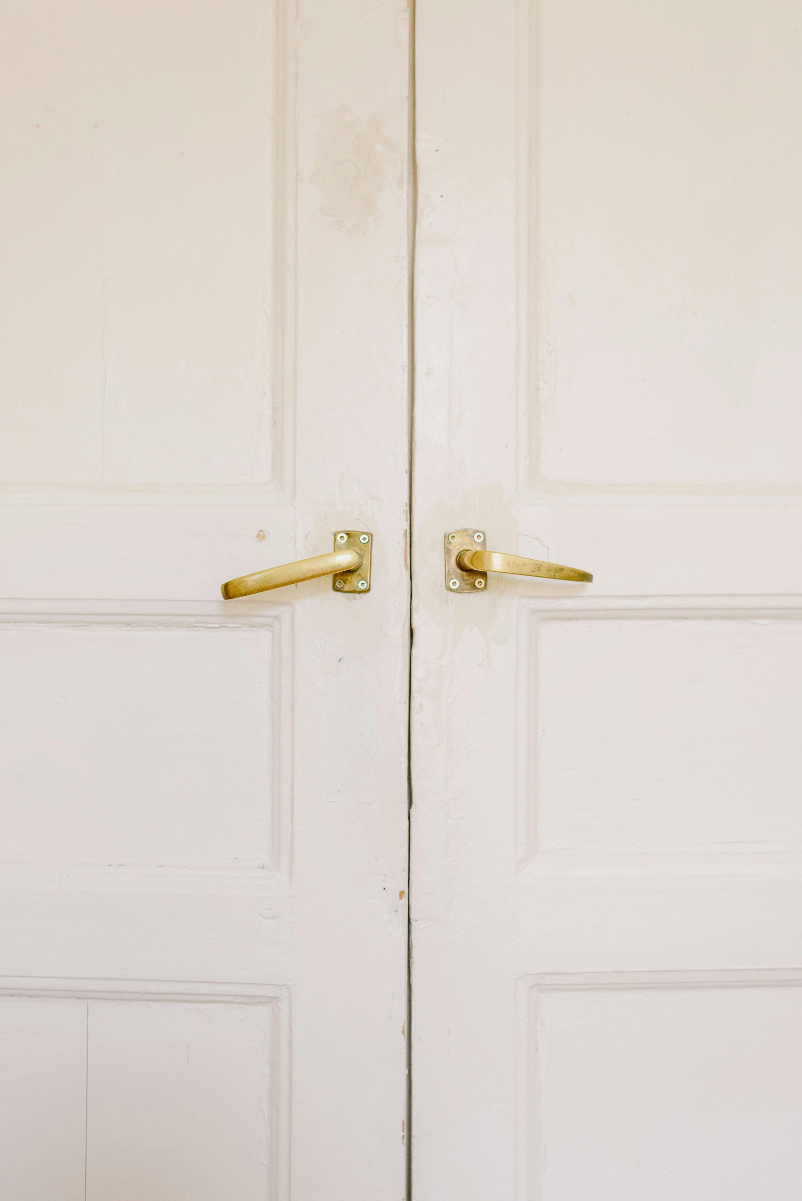 modern white house doors with golden handles