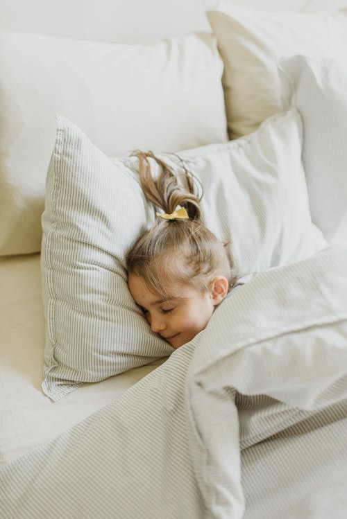 Free Photo of a Girl Sleeping on Bed  Stock Photo