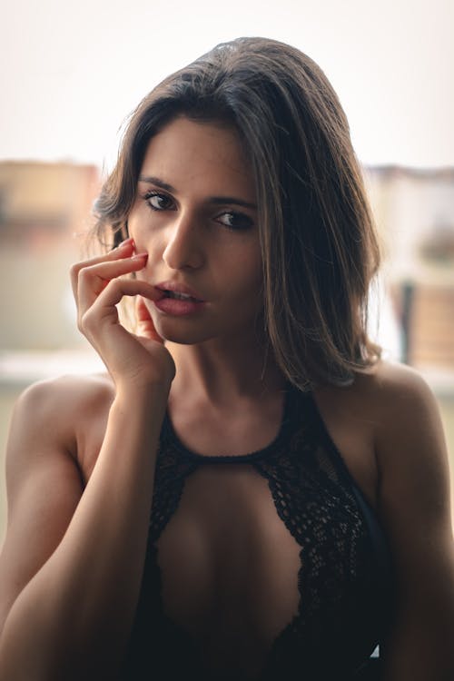Portrait of a Woman Posing with Her Hand on Her Cheek