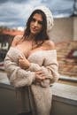 Woman in White Knit Sweater and White Knit Cap