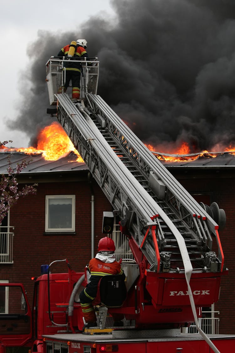 Firefighters On A Fire Truck