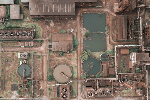 Aged industrial area with dirty roofs and ponds