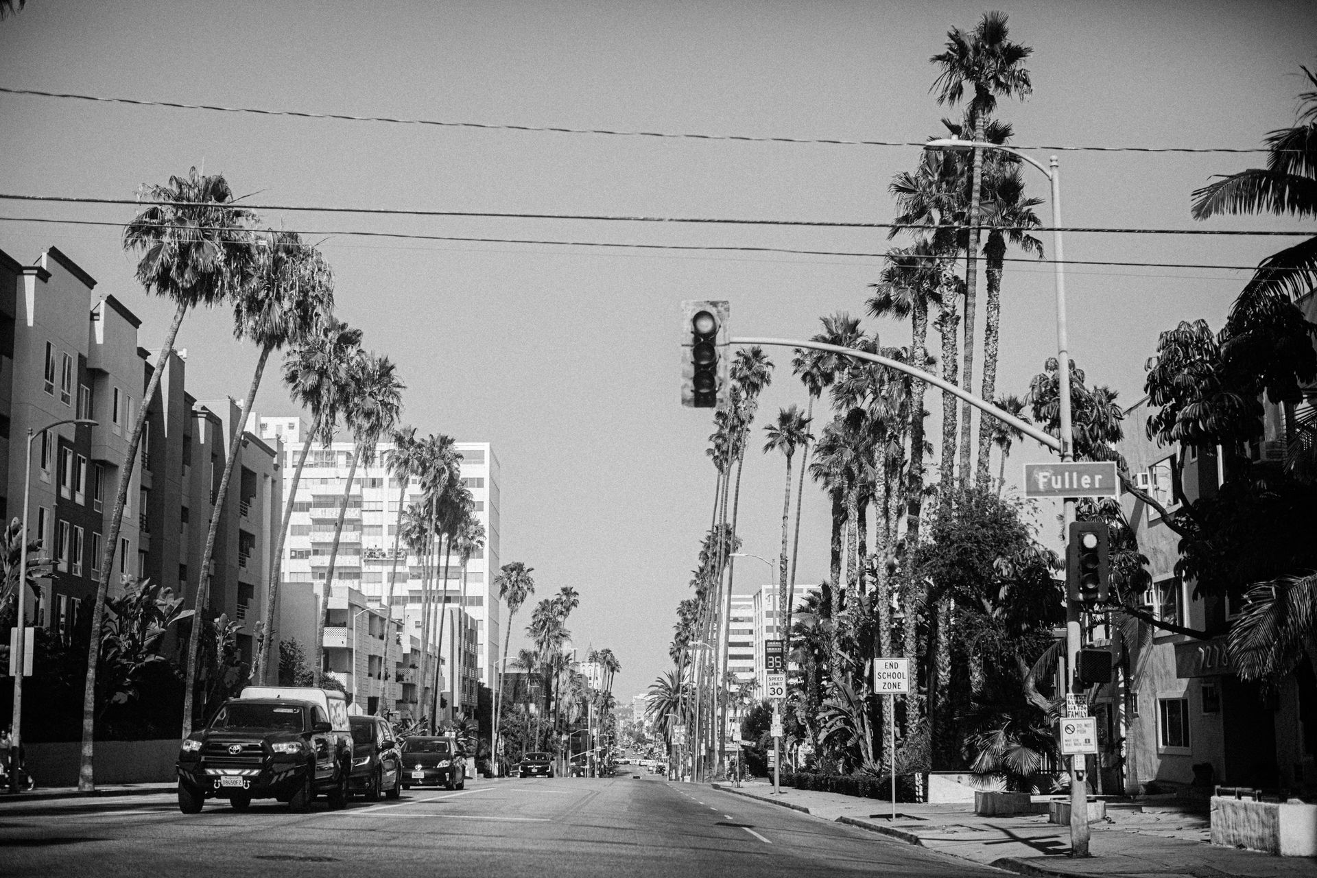 Grayscale Photo of Cars on Road