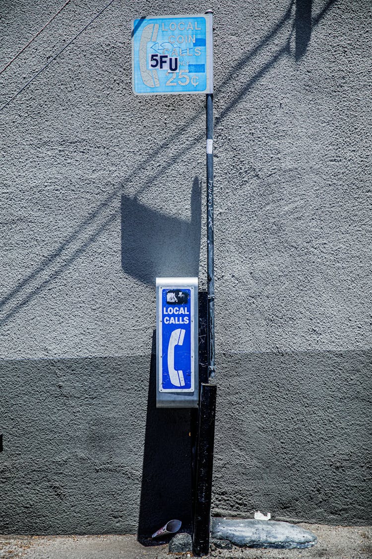 Public Phone On Street Sidewalk