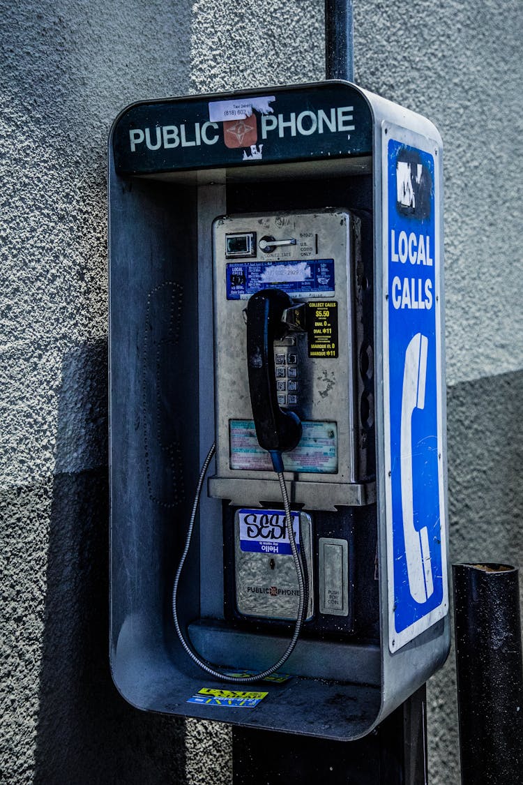 Public Telephone Booth On Street Sidewalk