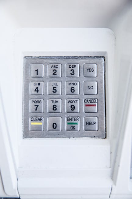 Detailed view of a secure electronic keypad with numbers and letters.