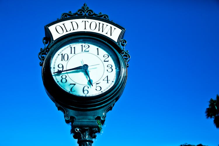 Close-Up Photo Of Public Vintage Clock