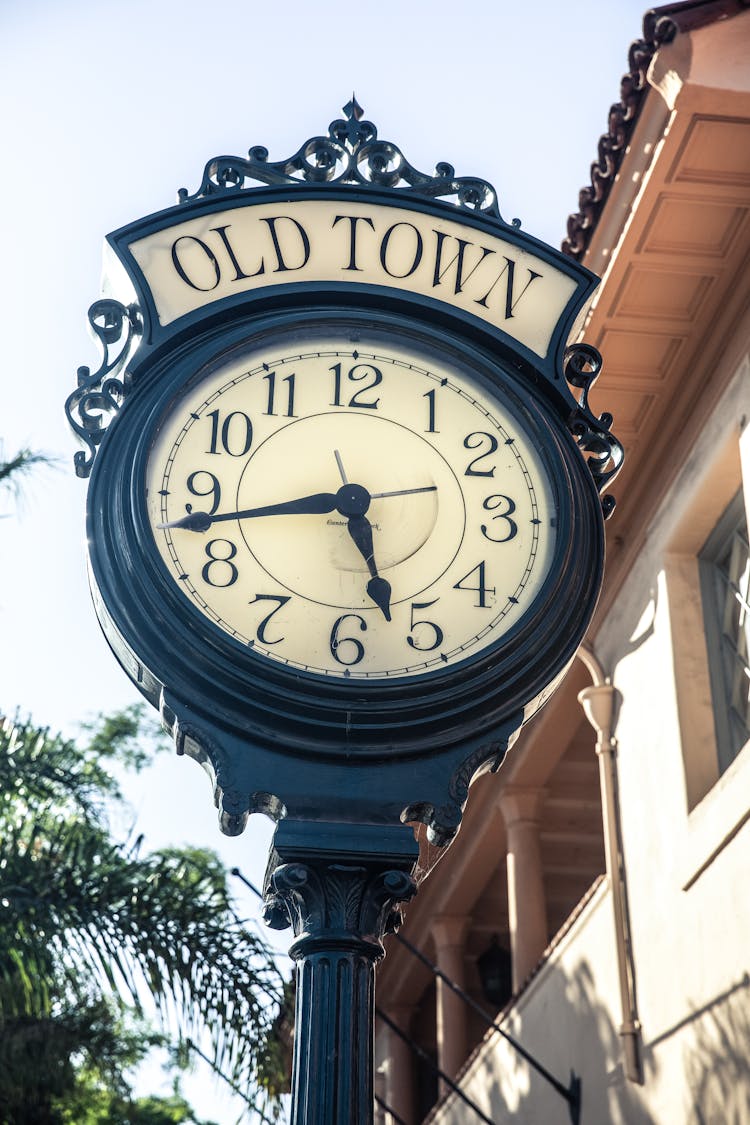 Close-Up Photo Of Public Vintage Clock