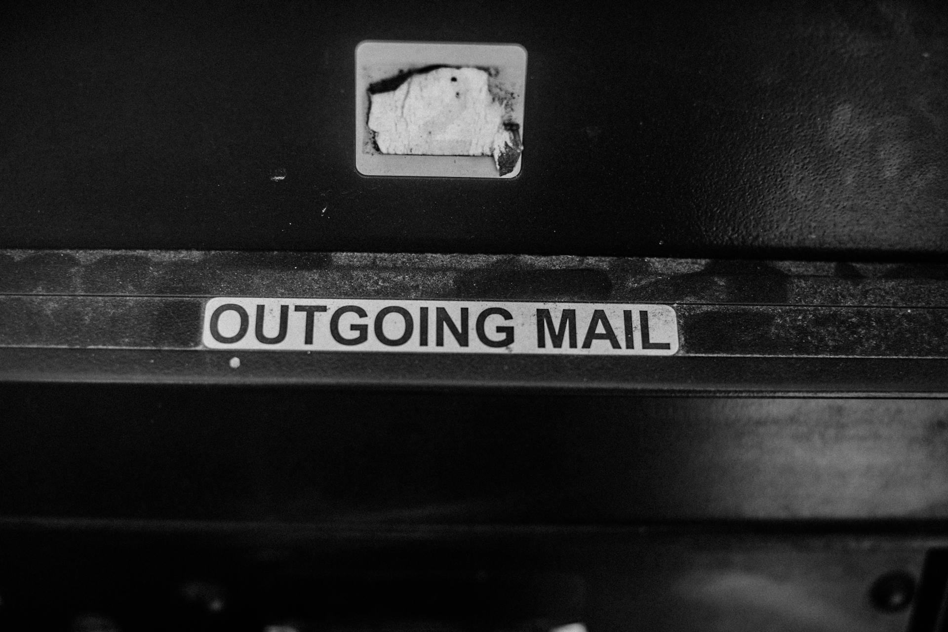 Sign Reading Outgoing Mail Above a Mailbox