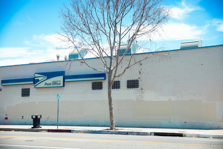 Post Office Signage On Exterior Wall Building