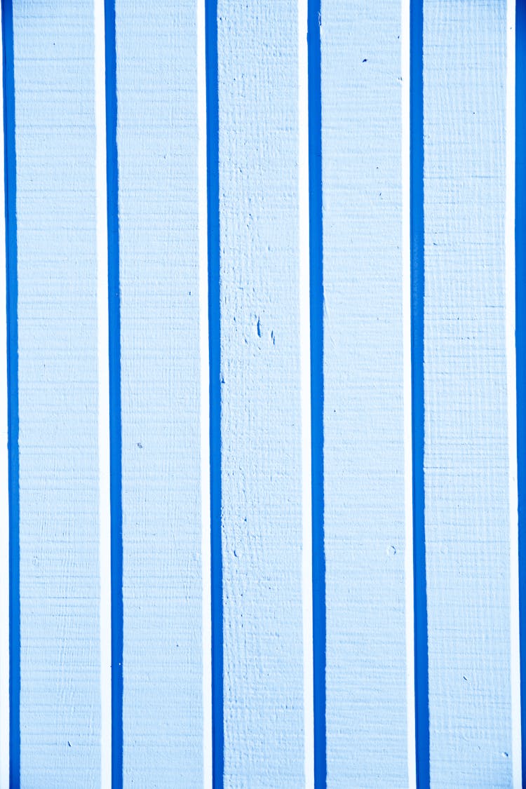 Blue And White Vertical Lines On Light Blue Surface