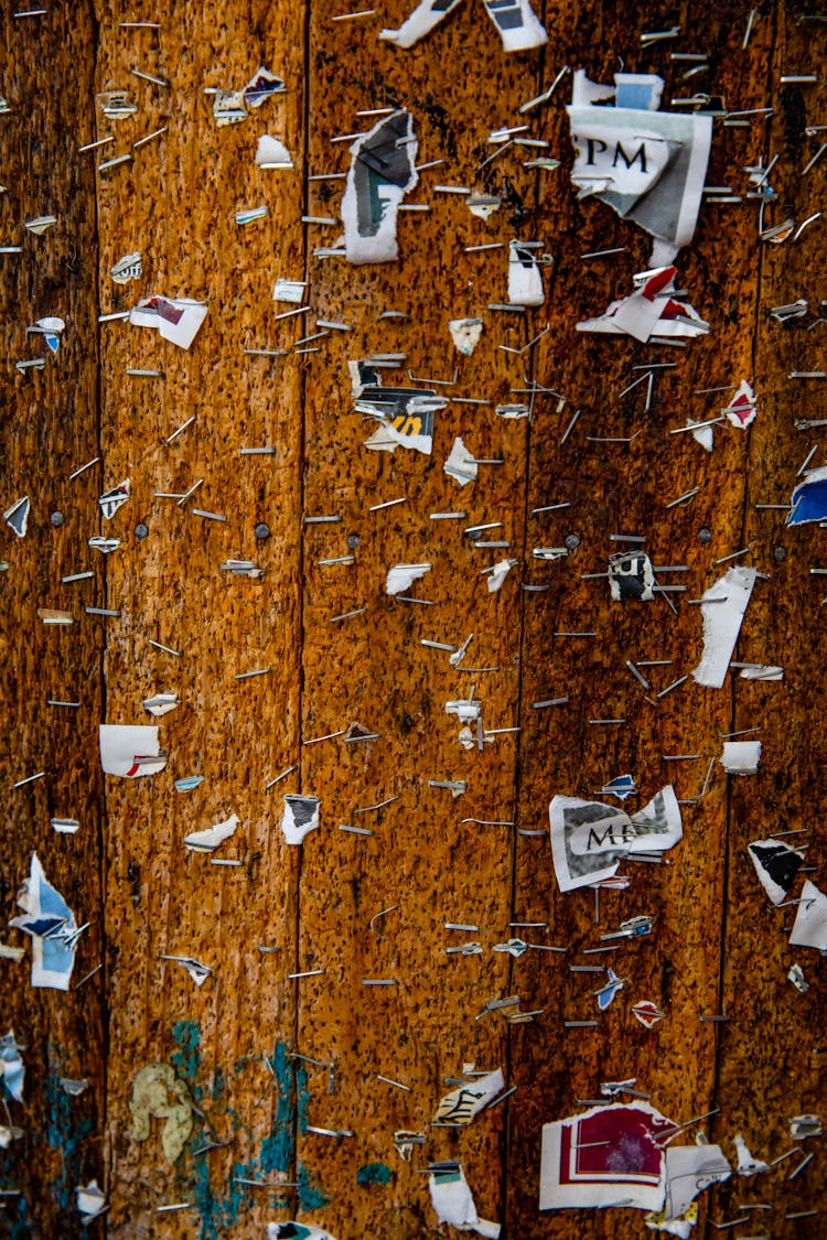 Brown Wood Planks With Pieces Of Papers And Staple Wires