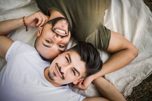 Free Men Lying on Blanket Stock Photo