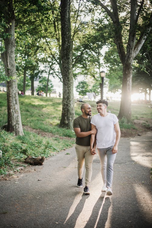 Two Men Walking and Holding Hands