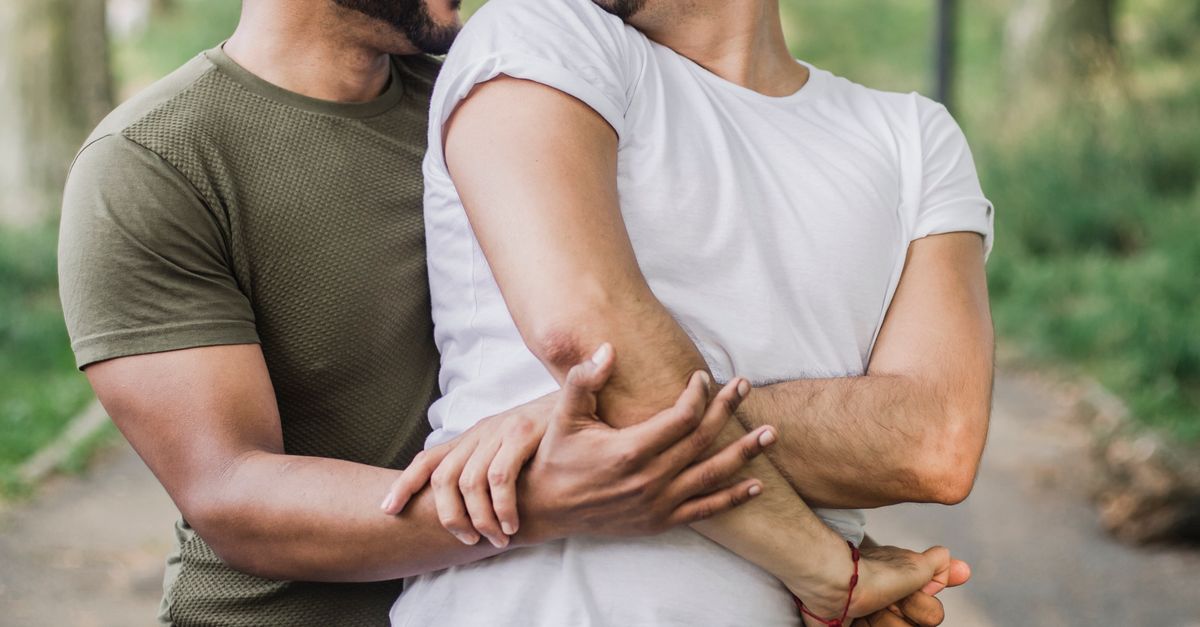 Two Men Holding Hands and Looking at Each Other · Free Stock Photo
