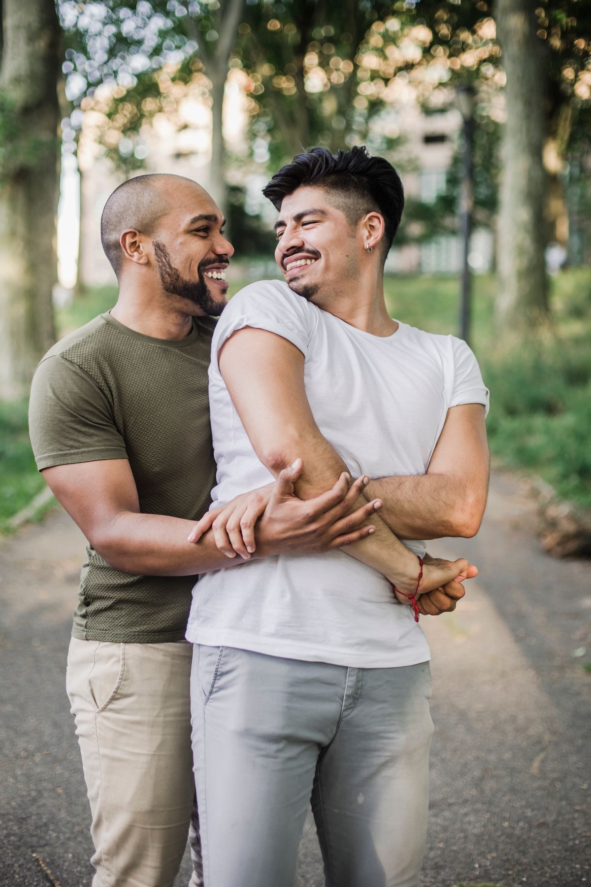 Two men connecting and holding hands