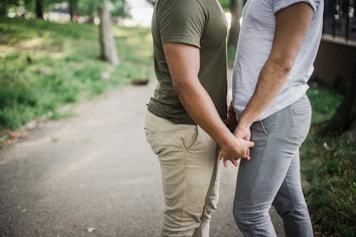 Free Two Men Holding Hands Stock Photo