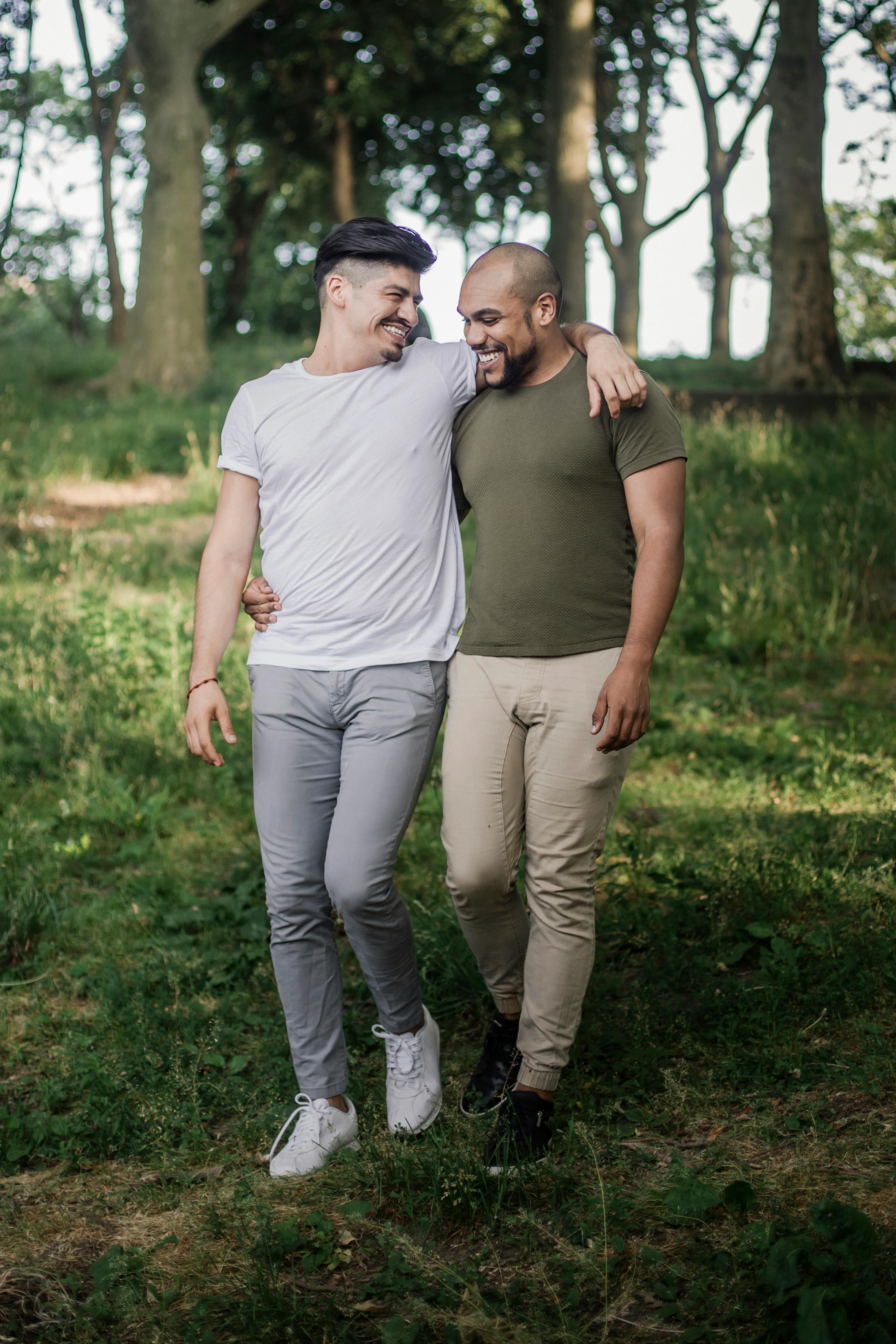 two men walking together and being affectionate