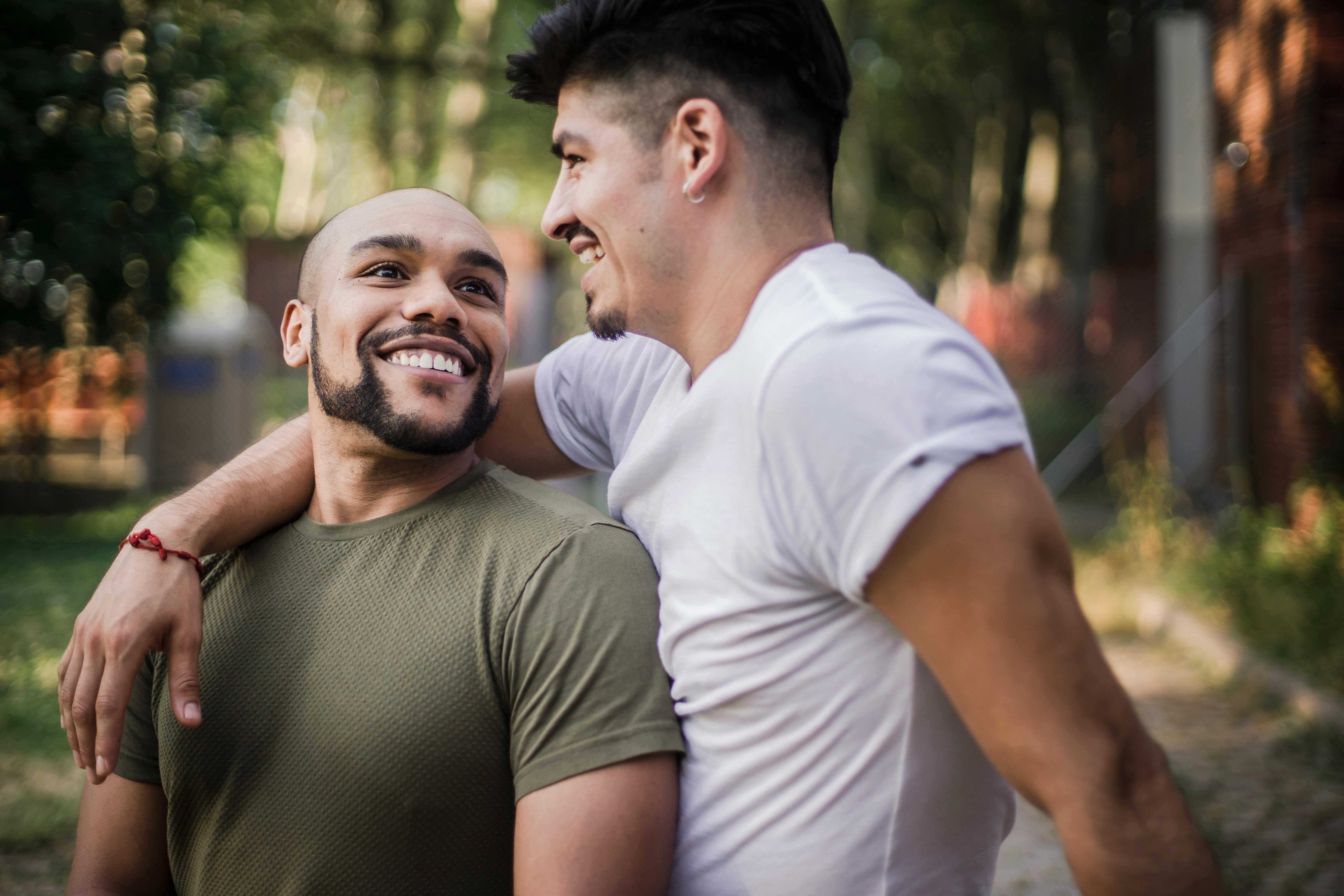 two happy men being affectionate