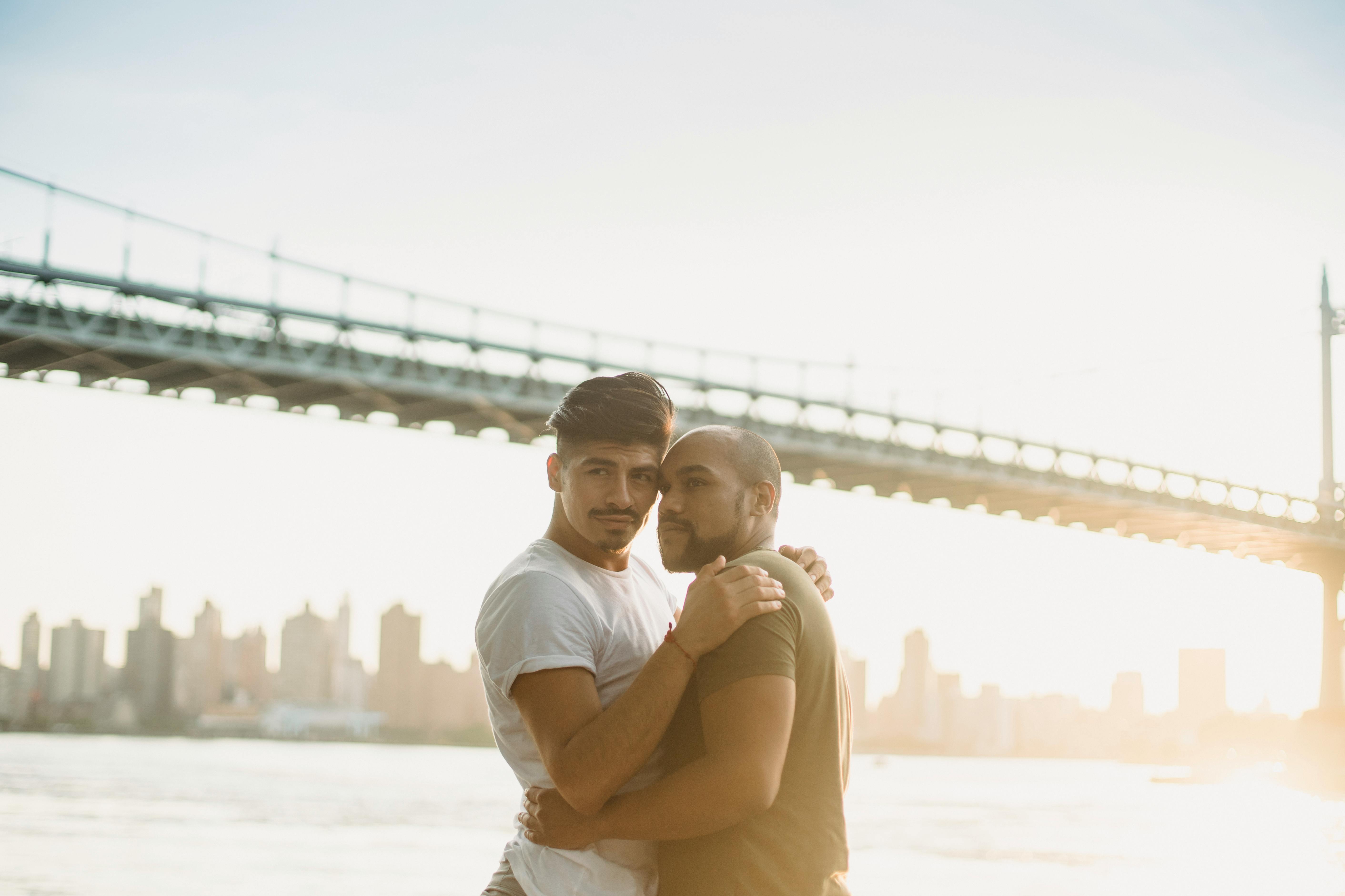 couple standing near metal bridge