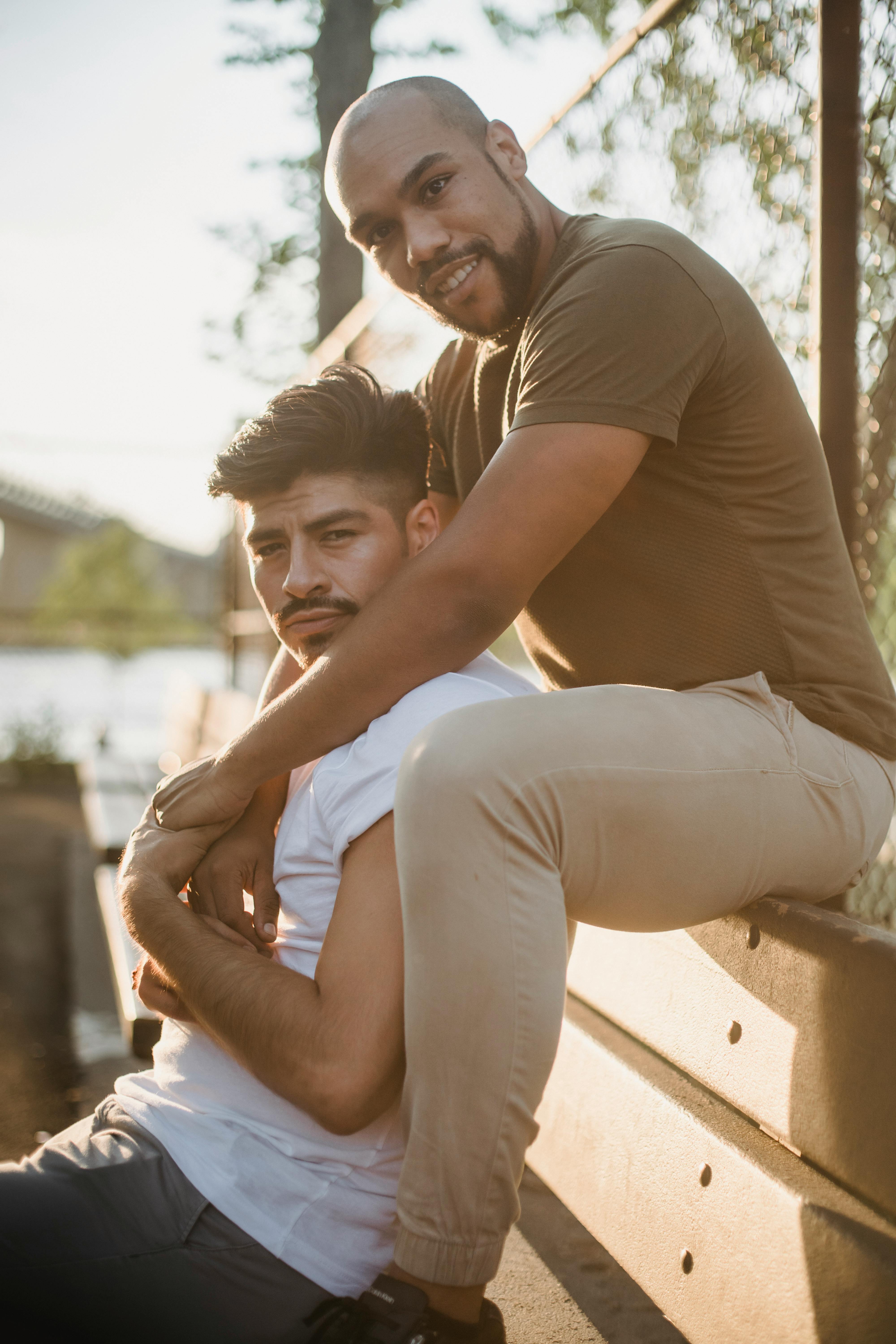 two men holding hands