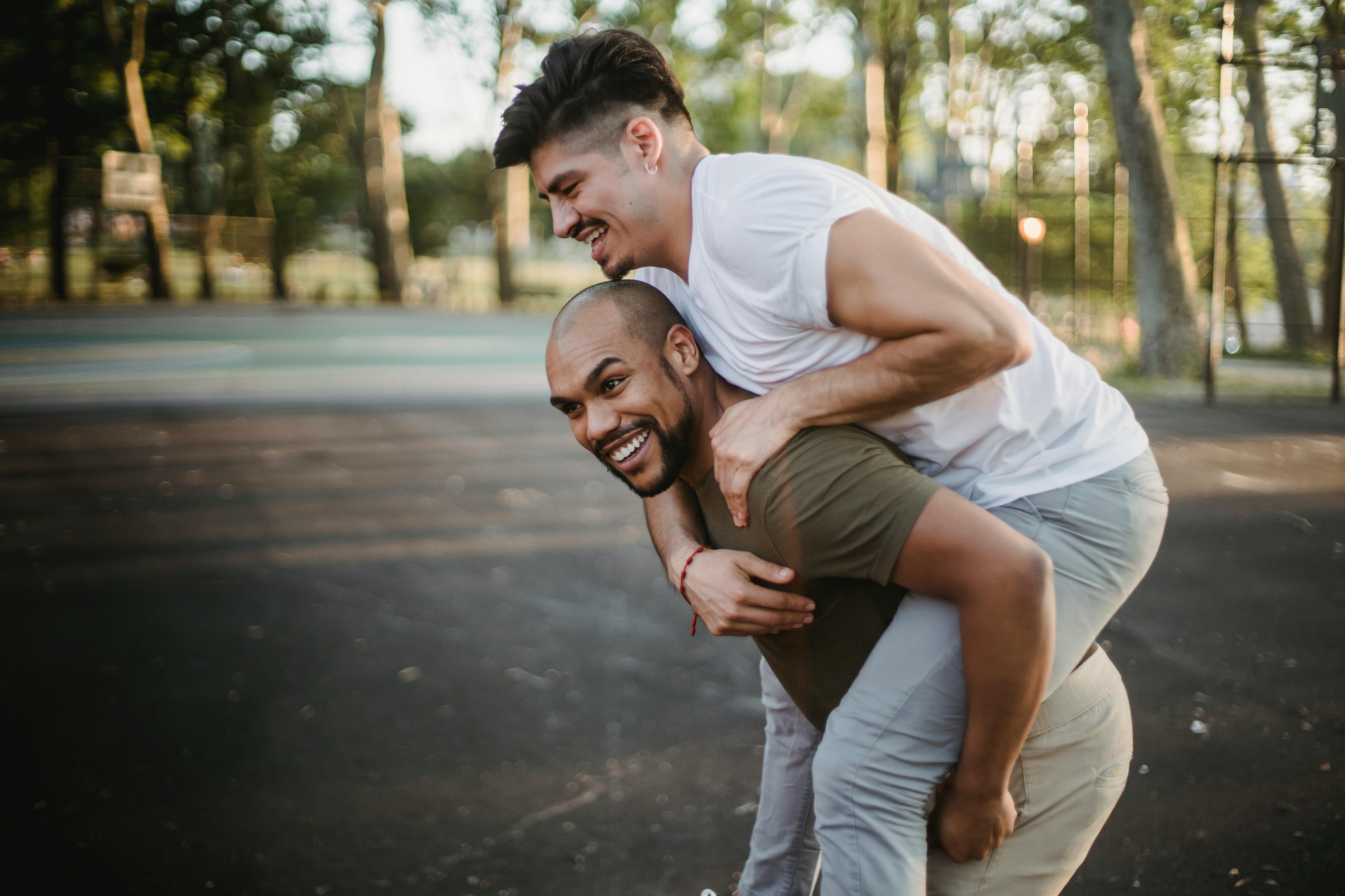 man carrying another man