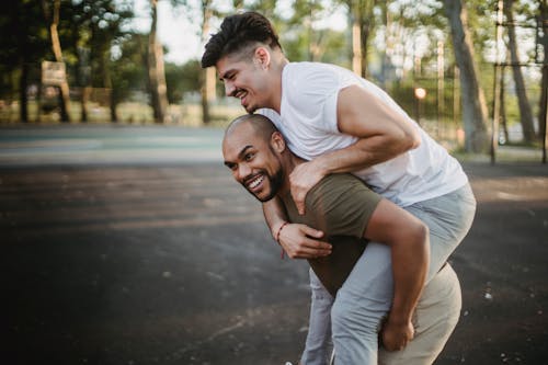 Man Carrying Another Man