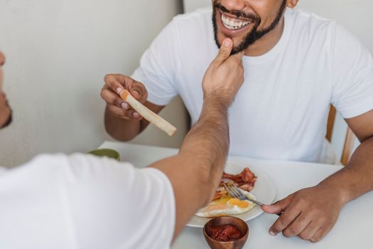 An intimate moment of a couple enjoying breakfast together, highlighting love and connection.