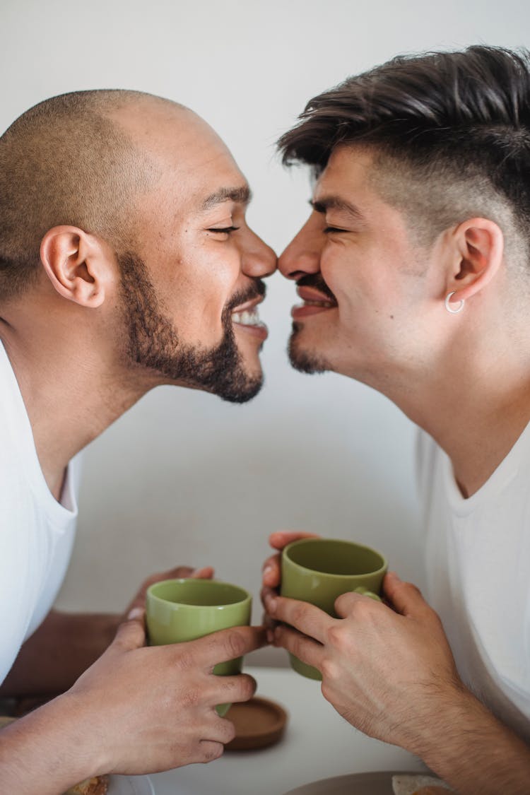 Gay Men Giving Eskimo Kiss Each Other