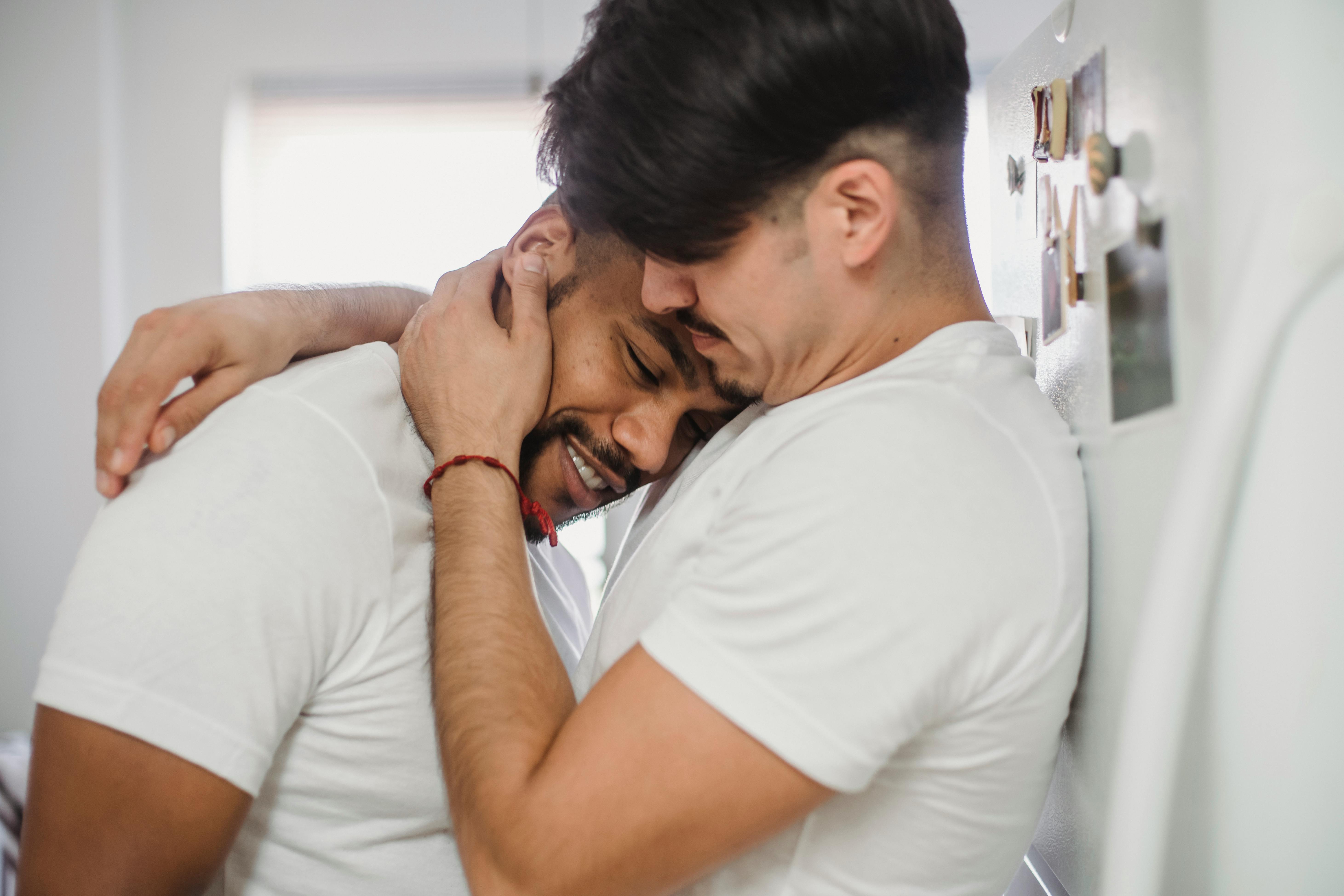 man hugging another man