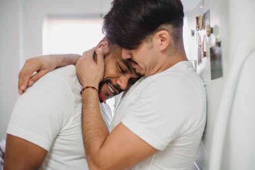 Man Hugging Another Man