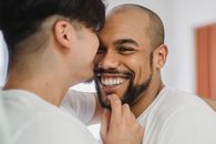 Man in White Crew Neck Shirt Smiling