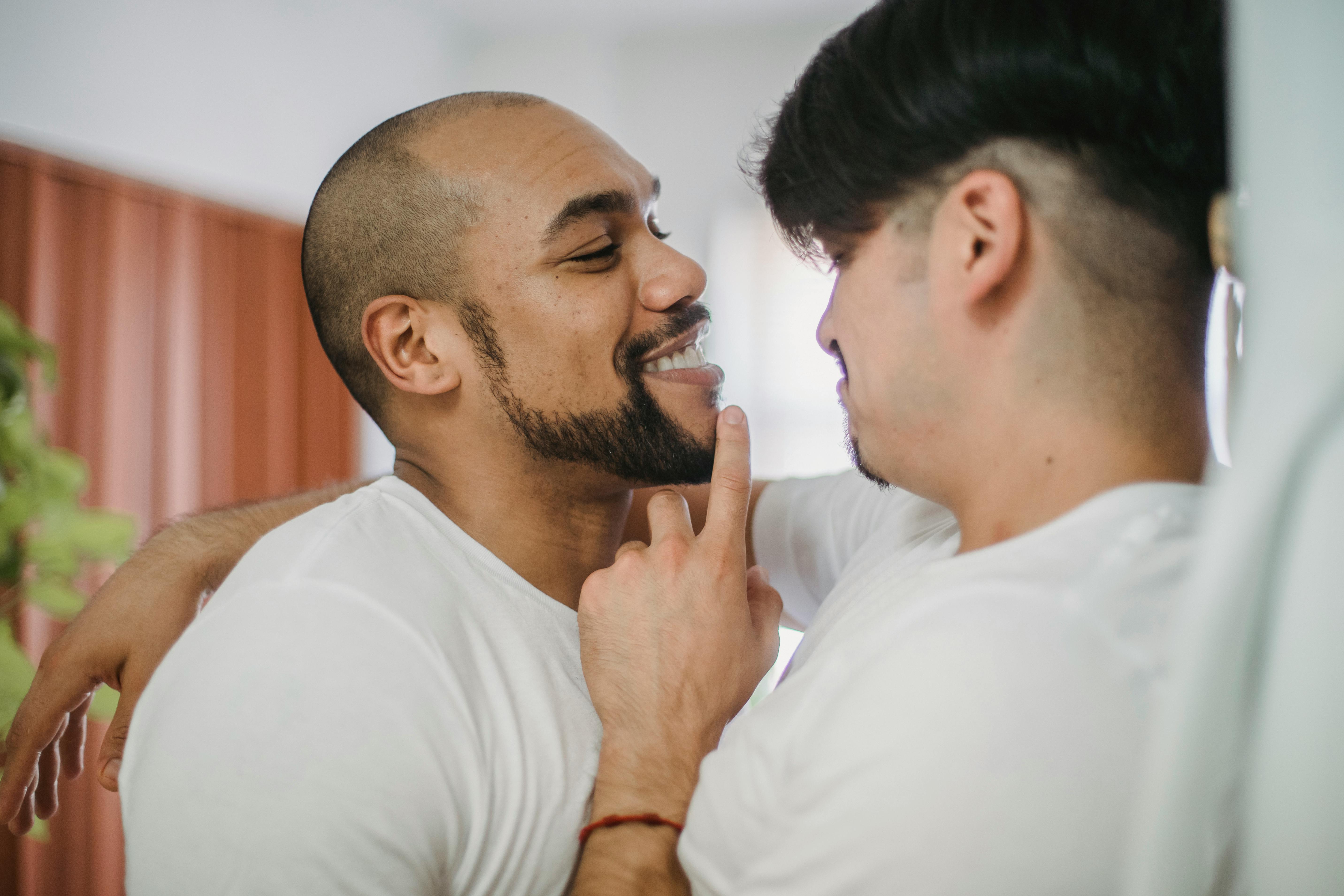 man touching chin of his partner