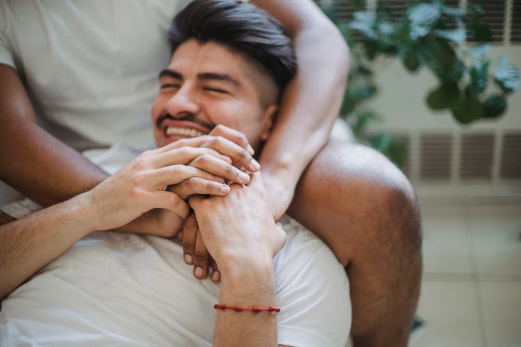 Unrecognizable Man Hands Embracing Other Man By Neck