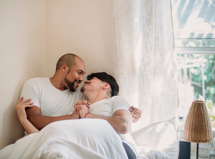 Couple enjoying a coffee date while smiling at each other