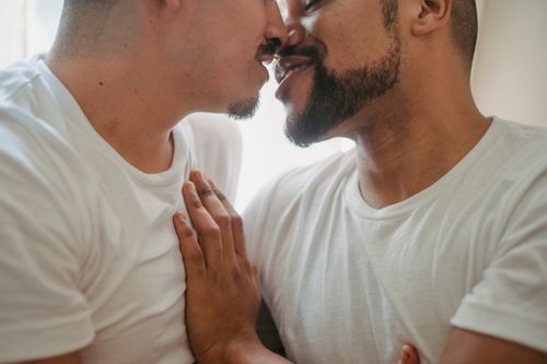 Free A close-up shot of a loving couple sharing an intimate moment indoors. Stock Photo