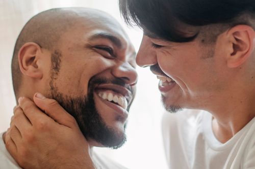 Free Intimate close-up of a joyful couple sharing a tender moment indoors. Stock Photo